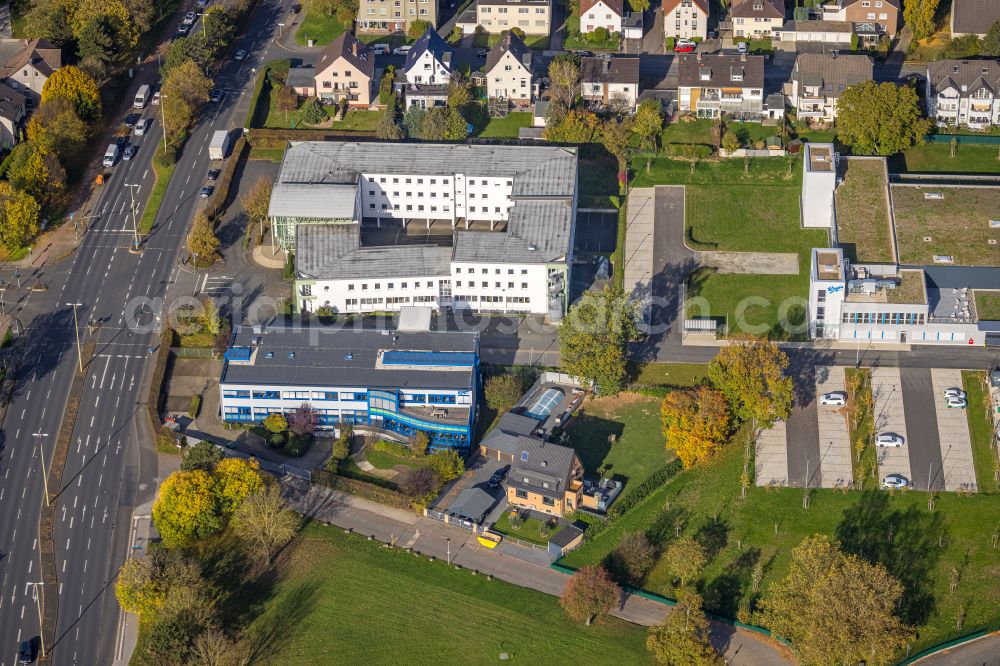 Hagen from the bird's eye view: Autumnal discolored vegetation view company grounds and facilities of Sanitaetshaus Riepe GmbH & Co. KG on Knippschildstrasse in Hagen at Ruhrgebiet in the state North Rhine-Westphalia, Germany