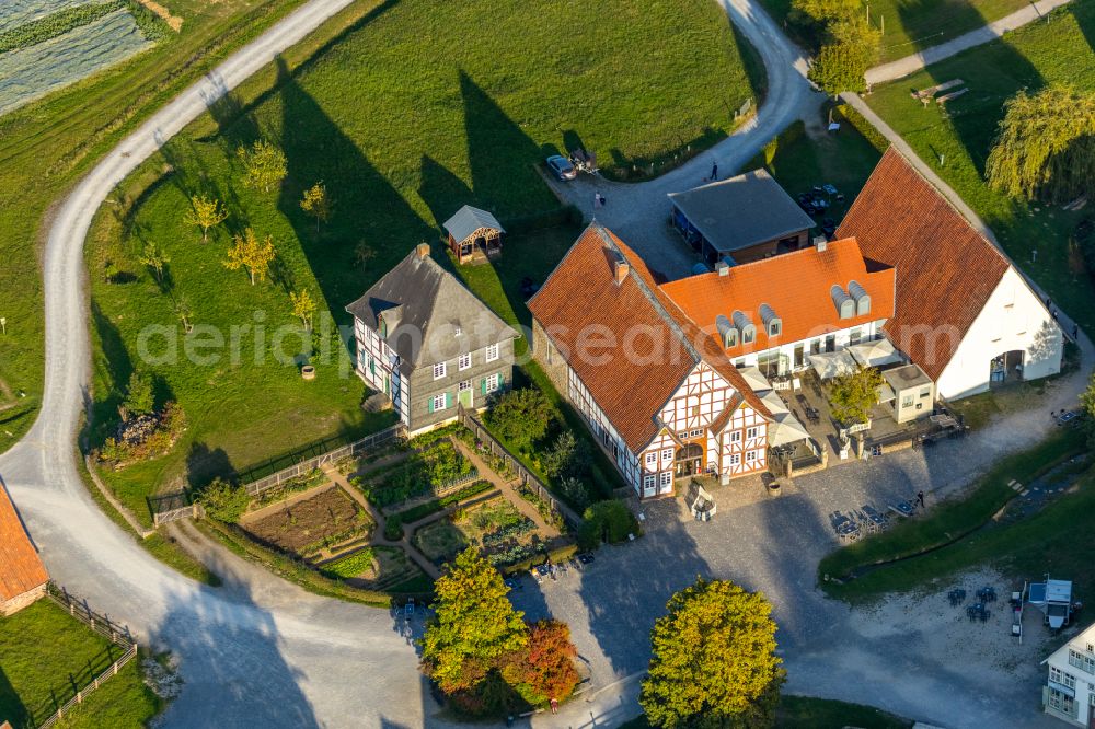 Detmold from the bird's eye view: Autumn colored vegetation view of the building of the restaurant Museumsgaststaette Im Weissen Ross in the open-air museum in Detmold in the state North Rhine-Westphalia, Germany