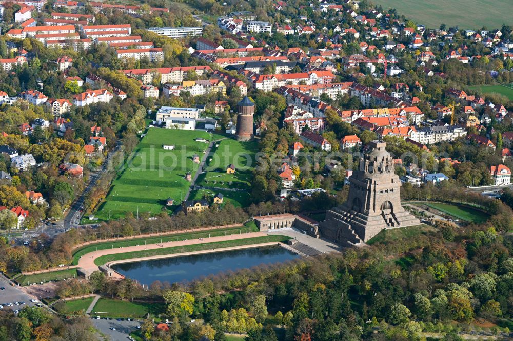 Aerial photograph Leipzig - Autumnal discolored vegetation view tourist attraction of the historic monument Voelkerschlachtdenkmal on Strasse of 18. Oktober in Leipzig in the state Saxony, Germany