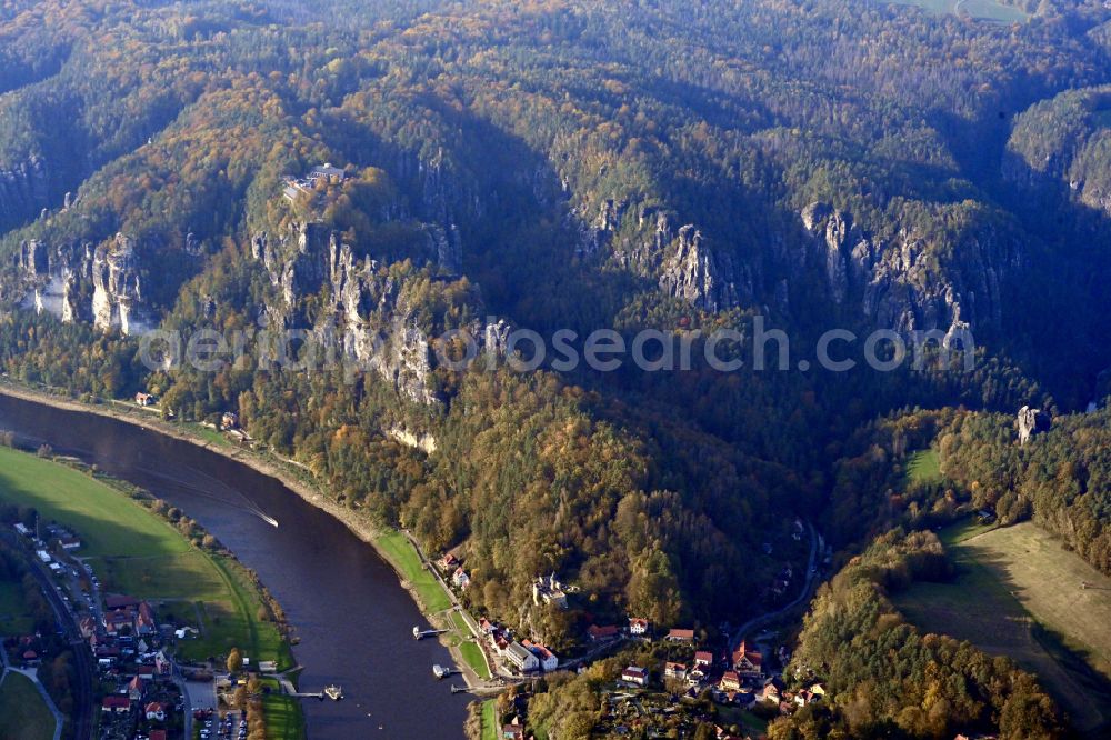 Rathen from above - Autumnal discolored vegetation view rock massif and rock formation Bastion in the Elbe Sandstone Mountains in Rathen in the state Saxony, Germany