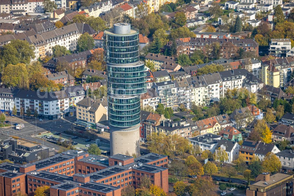 Bochum from the bird's eye view: Autumnal discolored vegetation view skyscraper Exenterhouse - Exenterhaus on a former bunker at the University Street in Bochum, North Rhine-Westphalia, Germany