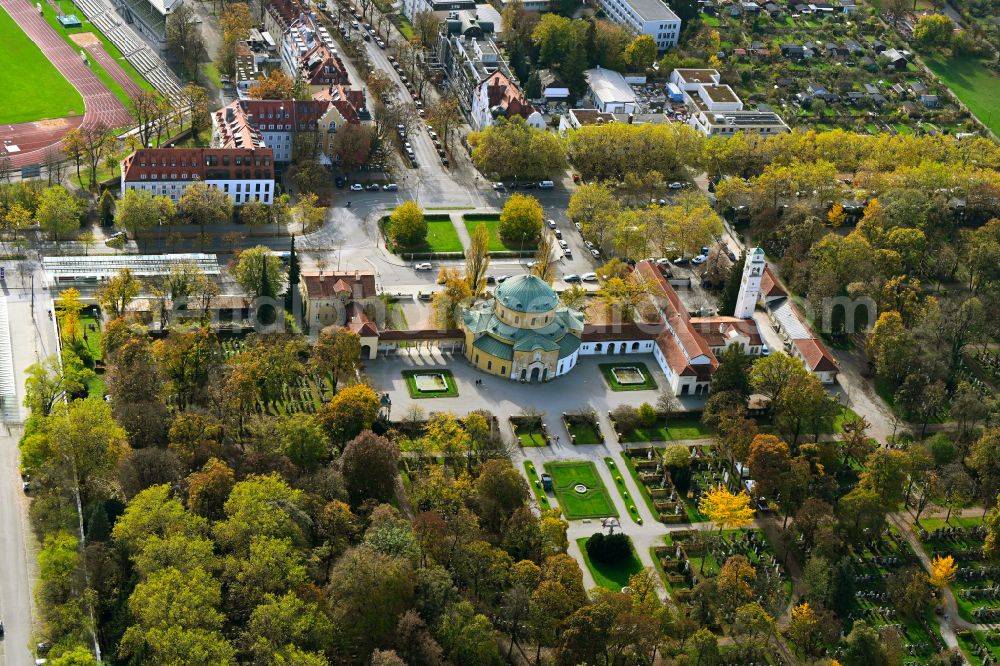 München from above - Autumnal discolored vegetation view churches building the chapel Aussegnungshalle on Westfriedhof on street Baldurstrasse in the district Moosach in Munich in the state Bavaria, Germany