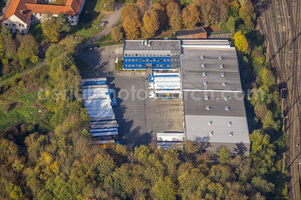 Aerial image Hagen - Autumnal discolored vegetation view warehouses and forwarding building Garbe Transport GmbH NL Hagen on street Haus Busch in Hagen at Ruhrgebiet in the state North Rhine-Westphalia, Germany
