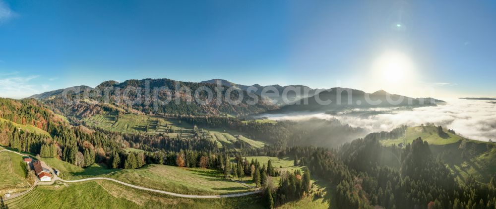 Oberstaufen from above - Autumnal discolored vegetation view forest and mountain landscape of the mid-mountain range of Naglflugkette on Huendle on street Hinterstaufen in Oberstaufen Allgaeu in the state Bavaria, Germany