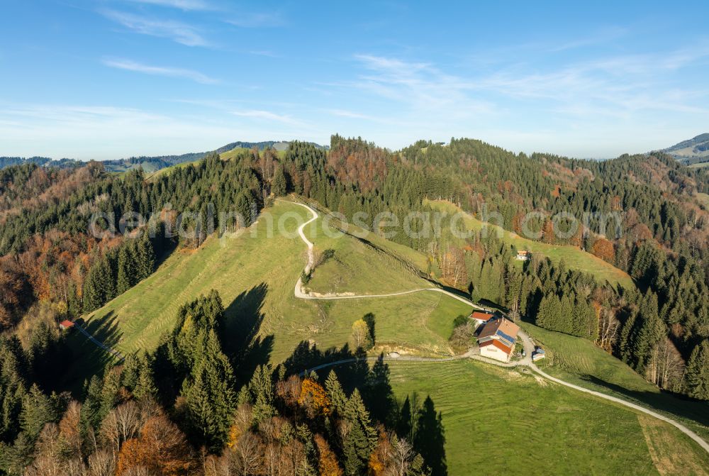 Oberstaufen from the bird's eye view: Autumnal discolored vegetation view forest and mountain landscape of the mid-mountain range of Naglflugkette on Huendle on street Hinterstaufen in Oberstaufen Allgaeu in the state Bavaria, Germany