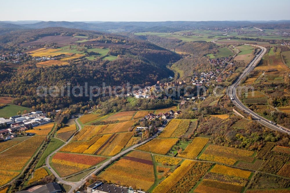 Neuleiningen from above - Autumnal discolored vegetation view town center on the edge of vineyards and wineries in the wine-growing area in Neuleiningen in the state Rhineland-Palatinate, Germany