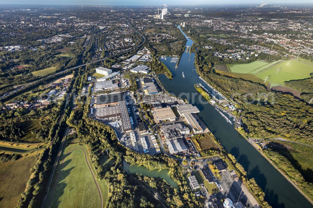 Castrop-Rauxel from above - Autumnal discolored vegetation view river Rhein-Herne-Kanal with industrial estate in Castrop-Rauxel at Ruhrgebiet in the state North Rhine-Westphalia, Germany