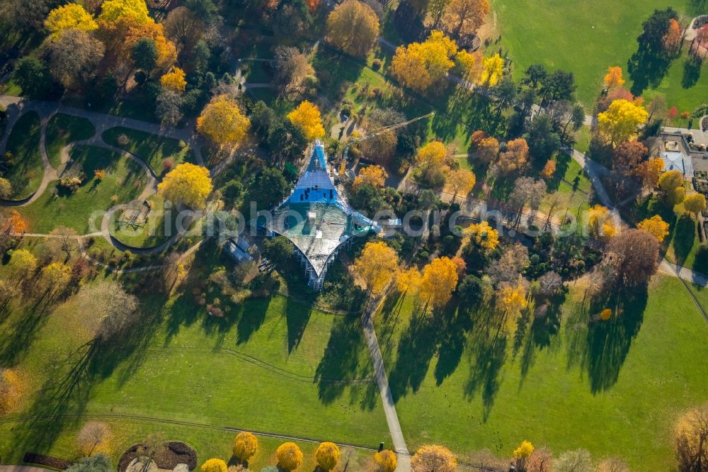 Aerial photograph Dortmund - Autumnal discolored vegetation view construction site for reconstruction and modernization and renovation of a building Sonnensegel in Westfalenpark in Dortmund in the state North Rhine-Westphalia, Germany