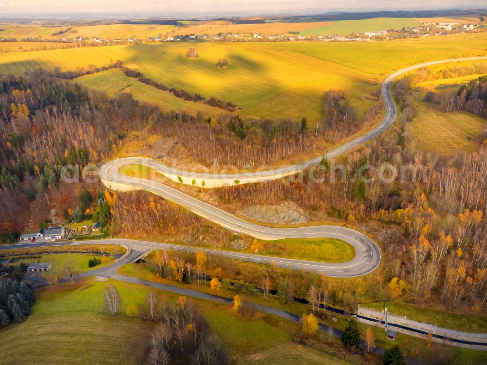 Aerial photograph Altenberg - Autumnal colored vegetation view of the serpentine road to Lauenstein in Altenberg in the state of Saxony, Germany