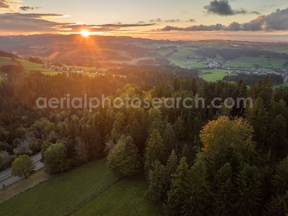 Oberreute from above - Autumnal discolored vegetation view weather-related cloud layer over forest and meadow landscape at sunset in Langenried im Allgaeu in the federal state of Bavaria, Germany