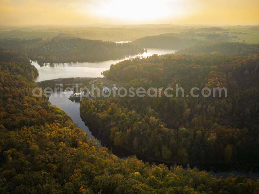 Aerial image Kriebstein - Autumnal discolored vegetation view dam wall at the reservoir the hydroelectric power plant on street An der Talsperre in Kriebstein in the state Saxony, Germany