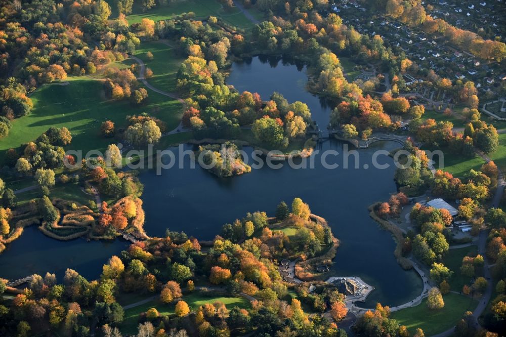 Berlin from above - Autumnal discolored vegetation view riparian areas on the lake area of Hauptsee in the recreation park Britz Garden in Berlin, Germany