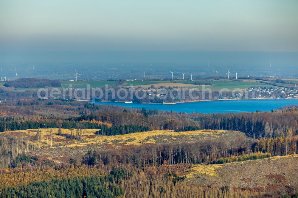 Möhnesee from above - Autumnal discolored vegetation view riparian areas on the lake area of Moehnesee with cleared forest areas in Moehnesee in the state North Rhine-Westphalia, Germany