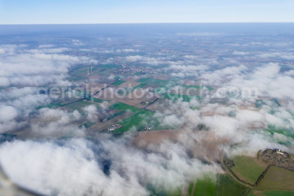 Warburg from above - Autumnal discolored vegetation view weather with layered fog cover in Warburg in the state North Rhine-Westphalia, Germany