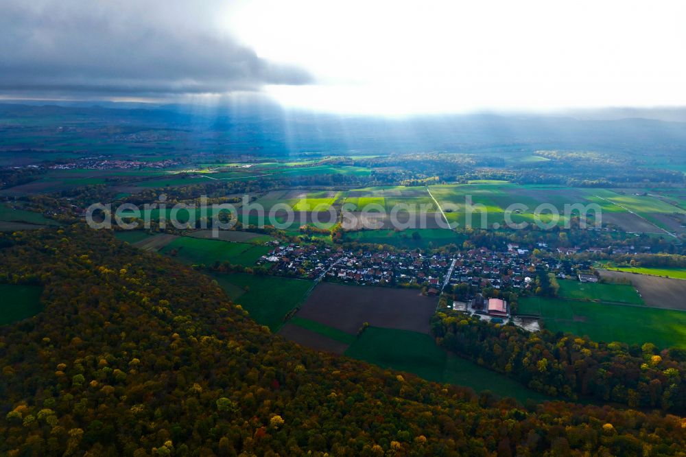 Aerial photograph Rosdorf - Autumnal discolored vegetation view weather situation with solar radiation from openings of the cloud cover in Rosdorf in the state Lower Saxony, Germany