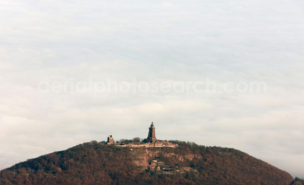 Aerial image Steinthaleben - Herbstwetter mit Hochnebel - Wolkendecke am Kyffhäuserdenkmal bei Steinthaleben in Thüringen. Das Kyffhäuserdenkmal (auch Barbarossadenkmal oder Kaiser-Wilhelm-Denkmal) auf der Kuppe des Kyffhäuserberges wurde 1890 bis 1896 zu Ehren von Kaiser Wilhelm I. errichtet. Es ist das drittgrößte Denkmal Deutschlands. Autumn weather with high fog - cloud cover at the Kyffhäuser monument at Steinthaleben in Thuringia. The Kyffhäuser monument (also Barbarossa Monument or Kaiser-Wilhelm-monument) on the top of the Mount Kyffhäuser was built from 1890 to 1896 in honor of Kaiser Wilhelm I.. It is the third largest monument in Germany.