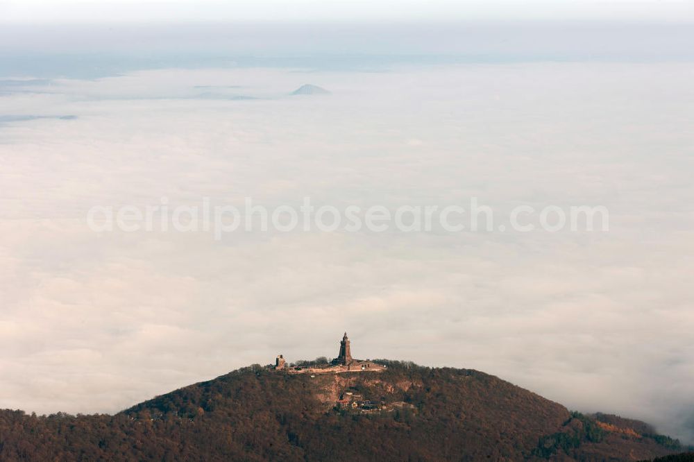 Aerial photograph Steinthaleben - Herbstwetter mit Hochnebel - Wolkendecke am Kyffhäuserdenkmal bei Steinthaleben in Thüringen. Das Kyffhäuserdenkmal (auch Barbarossadenkmal oder Kaiser-Wilhelm-Denkmal) auf der Kuppe des Kyffhäuserberges wurde 1890 bis 1896 zu Ehren von Kaiser Wilhelm I. errichtet. Es ist das drittgrößte Denkmal Deutschlands. Autumn weather with high fog - cloud cover at the Kyffhäuser monument at Steinthaleben in Thuringia. The Kyffhäuser monument (also Barbarossa Monument or Kaiser-Wilhelm-monument) on the top of the Mount Kyffhäuser was built from 1890 to 1896 in honor of Kaiser Wilhelm I.. It is the third largest monument in Germany.