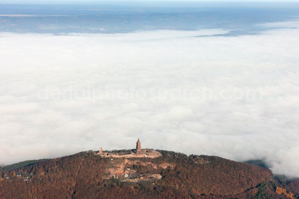 Steinthaleben from the bird's eye view: Herbstwetter mit Hochnebel - Wolkendecke am Kyffhäuserdenkmal bei Steinthaleben in Thüringen. Das Kyffhäuserdenkmal (auch Barbarossadenkmal oder Kaiser-Wilhelm-Denkmal) auf der Kuppe des Kyffhäuserberges wurde 1890 bis 1896 zu Ehren von Kaiser Wilhelm I. errichtet. Es ist das drittgrößte Denkmal Deutschlands. Autumn weather with high fog - cloud cover at the Kyffhäuser monument at Steinthaleben in Thuringia. The Kyffhäuser monument (also Barbarossa Monument or Kaiser-Wilhelm-monument) on the top of the Mount Kyffhäuser was built from 1890 to 1896 in honor of Kaiser Wilhelm I.. It is the third largest monument in Germany.