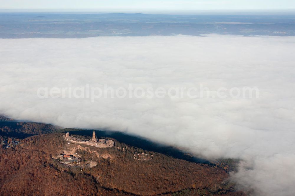 Aerial photograph Steinthaleben - Herbstwetter mit Hochnebel - Wolkendecke am Kyffhäuserdenkmal bei Steinthaleben in Thüringen. Das Kyffhäuserdenkmal (auch Barbarossadenkmal oder Kaiser-Wilhelm-Denkmal) auf der Kuppe des Kyffhäuserberges wurde 1890 bis 1896 zu Ehren von Kaiser Wilhelm I. errichtet. Es ist das drittgrößte Denkmal Deutschlands. Autumn weather with high fog - cloud cover at the Kyffhäuser monument at Steinthaleben in Thuringia. The Kyffhäuser monument (also Barbarossa Monument or Kaiser-Wilhelm-monument) on the top of the Mount Kyffhäuser was built from 1890 to 1896 in honor of Kaiser Wilhelm I.. It is the third largest monument in Germany.