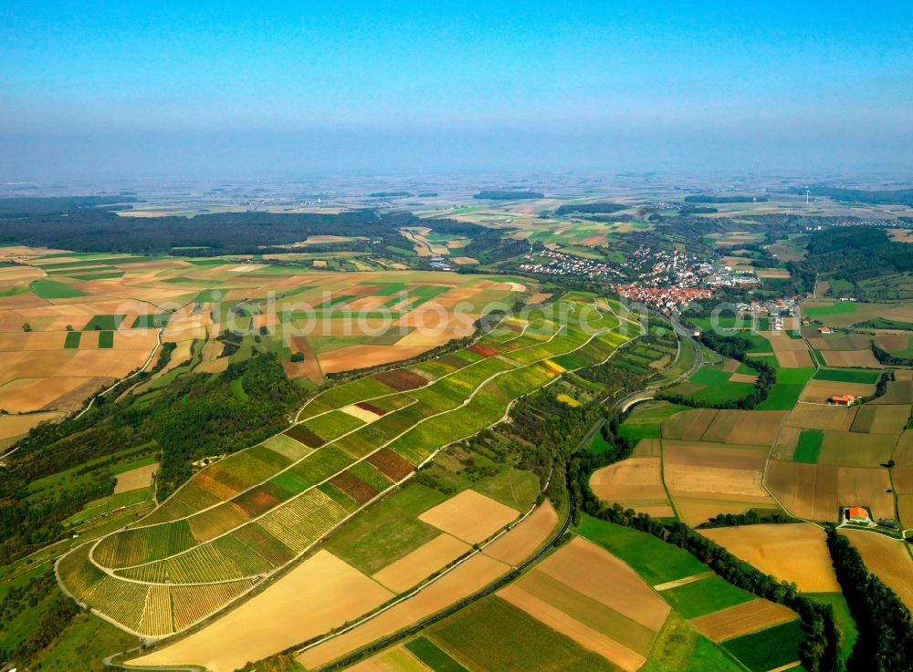 Aerial image Röttingen - Hills landscape and fields in Roettingen in the state of Bavaria. Roettingen is located in the valley of the river Tauber between hills that are used agriculturally. It is the southernmost town in the district of Wuerzburg