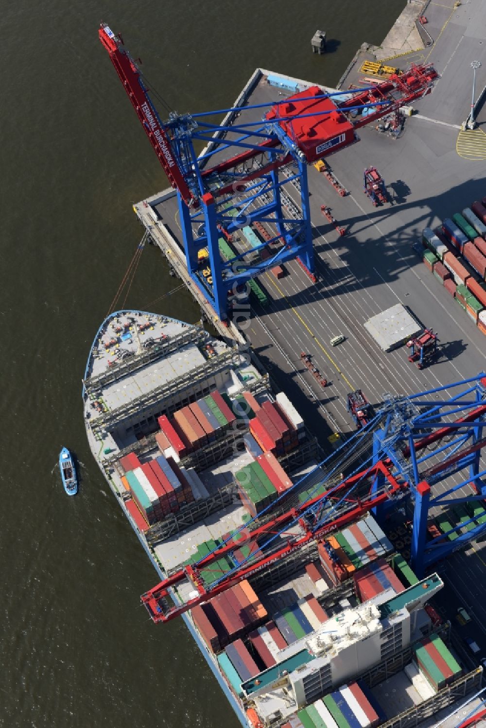 Aerial image Hamburg - View on container and container ships at berth HHLA Logistics Container Terminal Burchhardkai and Walter Hofer Euro Gate Container Terminal in the Port of Hamburg harbor in Hamburg. Containership MOL Triumph