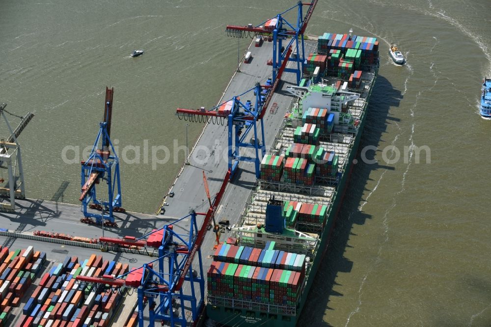 Hamburg from above - View on container and container ships at berth HHLA Logistics Container Terminal Burchhardkai and Walter Hofer Euro Gate Container Terminal in the Port of Hamburg harbor in Hamburg. Containership MOL Triumph