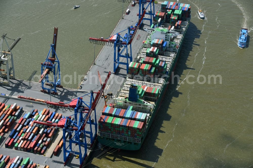 Hamburg from the bird's eye view: View on container and container ships at berth HHLA Logistics Container Terminal Burchhardkai and Walter Hofer Euro Gate Container Terminal in the Port of Hamburg harbor in Hamburg. Containership MOL Triumph