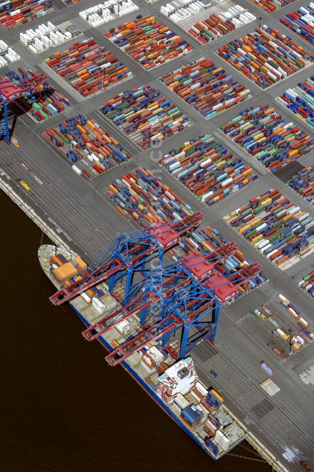 Hamburg from the bird's eye view: View on container and container ships at berth HHLA Logistics Container Terminal Tollerort and Walter Hofer Euro Gate Container Terminal in the Port of Hamburg harbor in Hamburg