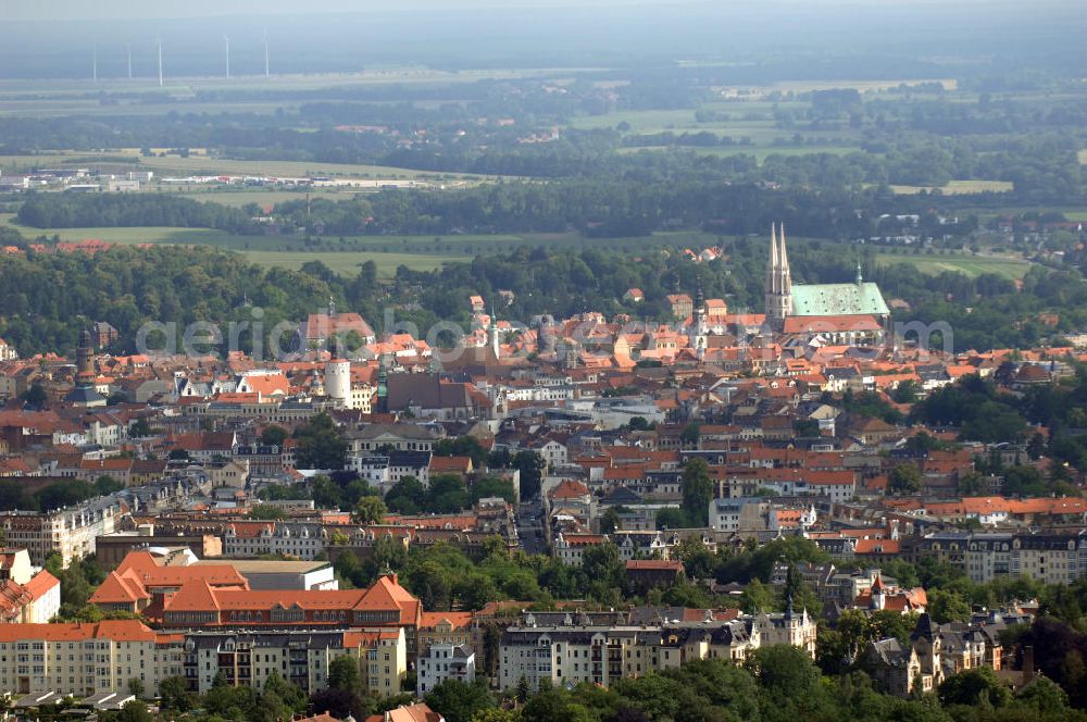 Aerial photograph Görlitz - Blick auf die historische Altstadt von Görlitz mit dem Wahrzeichen der Stadt, der 1497 fertiggestellten Kirche St. Peter und Paul mit dem weithin sichtbaren Turmpaar. Görlitz ist die östlichste Stadt Deutschlands und liegt in der Oberlausitz an der Lausitzer Neiße, die hier seit 1945 die Grenze zu Polen bildet. Der östlich der Neiße gelegene und wesentlich kleinere Teil der Stadt wurde durch die Grenzziehung in den Jahren nach dem Zweiten Weltkrieg abgetrennt und bildet seitdem die eigenständige polnische Stadt Zgorzelec. Mit 3500 größtenteils restaurierten Baudenkmälern weist sie eines der besterhaltenen historischen Stadtbilder in Deutschland auf und bildet das größte Flächendenkmal Deutschlands.