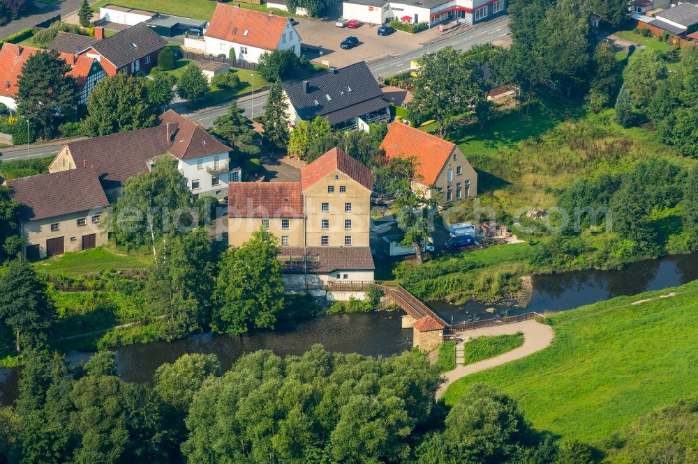 Aerial image Kirchlengern - Historic mill on the riverbank of the river Else in Kirchlengern in the state of North Rhine-Westphalia. The mill was converted into one of the first power plants in Else valley at the beginning of the 20th century