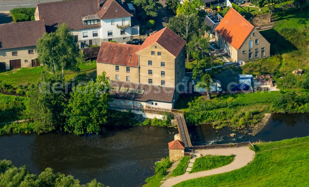 Aerial photograph Kirchlengern - Historic mill on the riverbank of the river Else in Kirchlengern in the state of North Rhine-Westphalia. The mill was converted into one of the first power plants in Else valley at the beginning of the 20th century