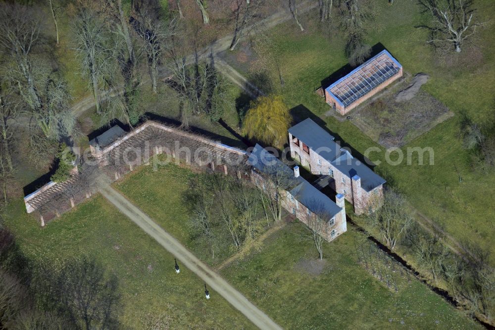 Märkisch Wilmersdorf from above - The historic nursery belongs next to the castle and the farmyard with the ensemble of buildings in the castle park Maerkisch Wilmersdorf in Trebbin in the state of Brandenburg. The restoration of the castle park is considered an architectural and historical monument of garden view as exemplary. The site is not public!