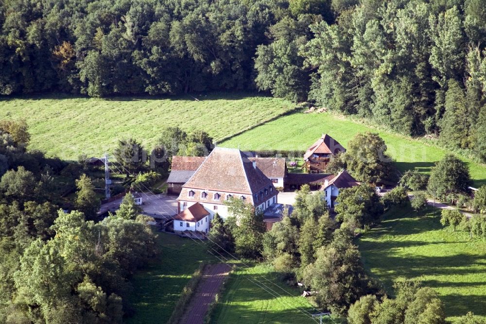 Scheibenhardt from above - Historic watermill on a farm homestead on the edge of cultivated fields in the district Bienwaldmuehle in Scheibenhardt in the state Rhineland-Palatinate