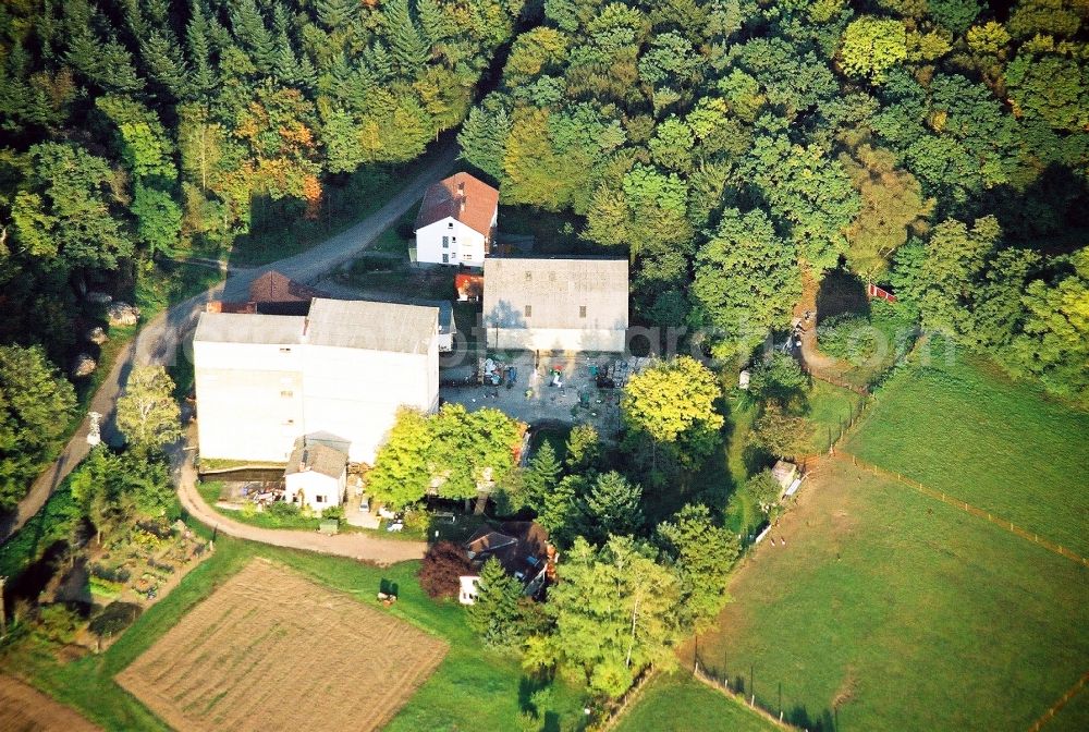 Kandel from the bird's eye view: Historic watermill on a farm homestead on the edge of cultivated meadows in Kandel in the state Rhineland-Palatinate