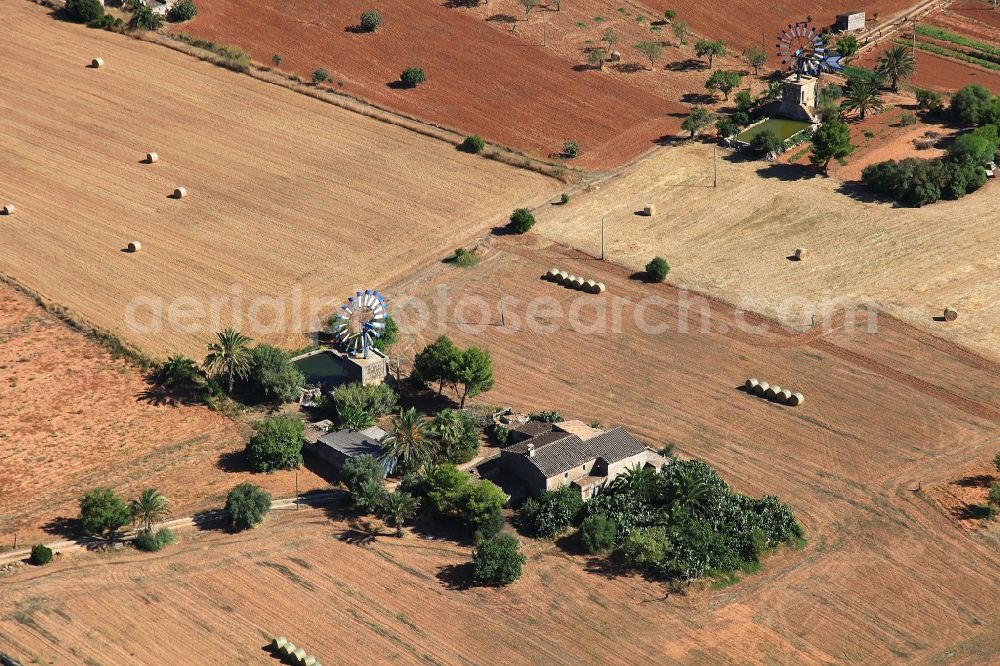 Aerial image Campos - Historic windmill on a farm homestead on the edge of cultivated fields in Campos in Balearic Islands, Mallorca, Spain