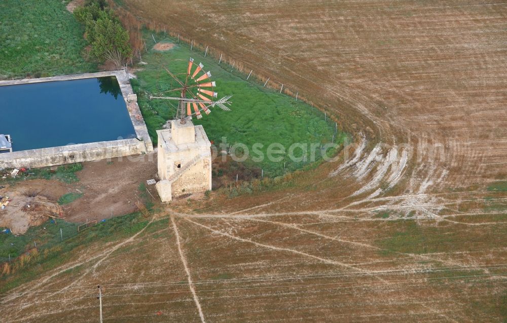 Aerial image Manacor - Historic windmill on a farm homestead on the edge of cultivated fields in Manacor in Balearic Islands, Mallorca, Spain