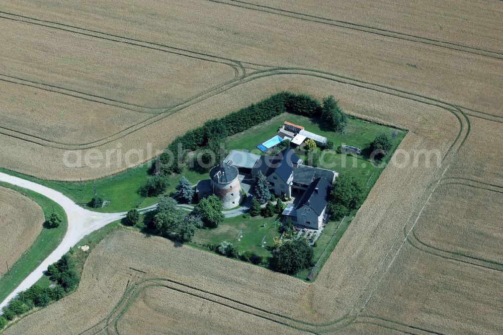 Wildenbörten from above - Historic windmill on a farm homestead on the edge of cultivated fields in Wildenboerten in the state Thuringia