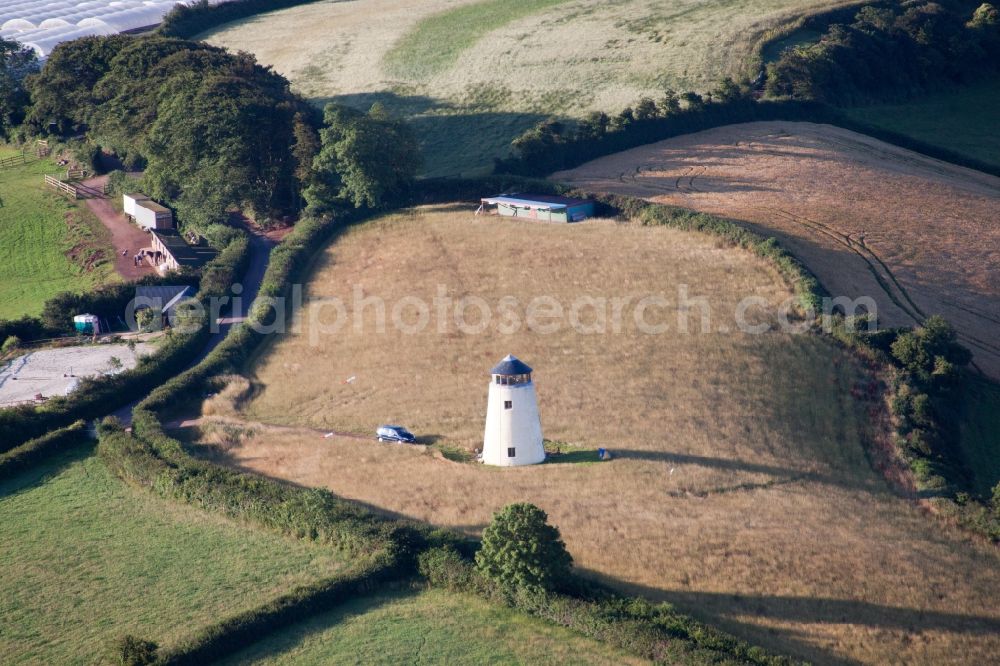 Whilborough from the bird's eye view: Historic windmill on the edge of cultivated fields in Whilborough in England, United Kingdom