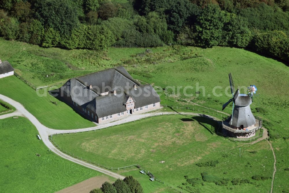 Aerial image Rammsee - Historic windmill on a farm homestead on the edge of cultivated fields in Rammsee in the state Schleswig-Holstein