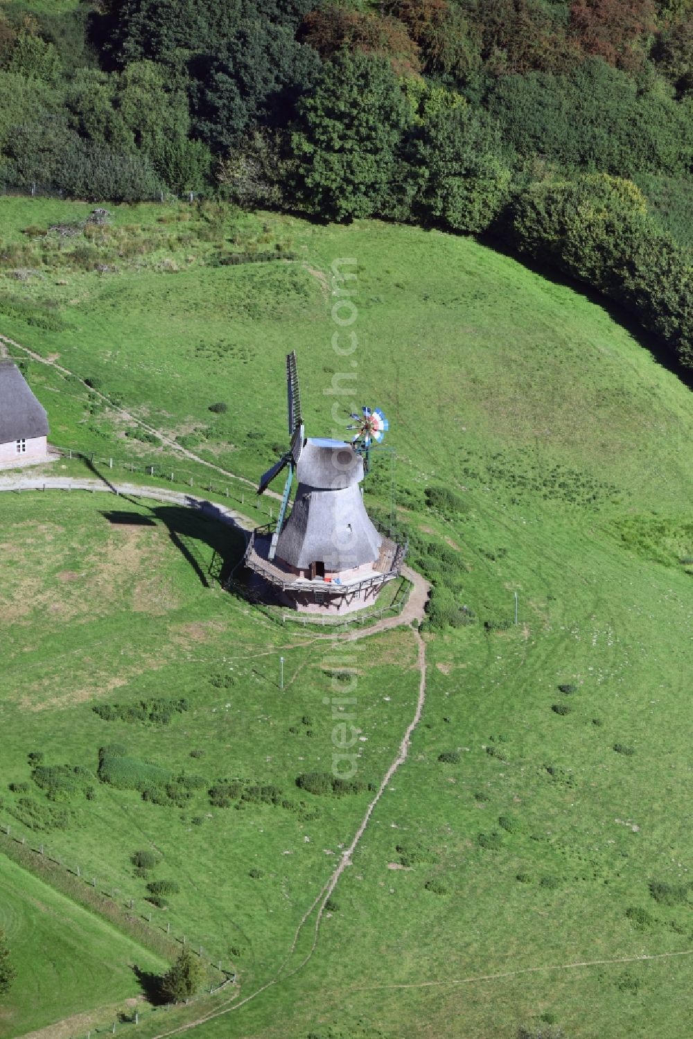 Aerial photograph Rammsee - Historic windmill on a farm homestead on the edge of cultivated fields in Rammsee in the state Schleswig-Holstein