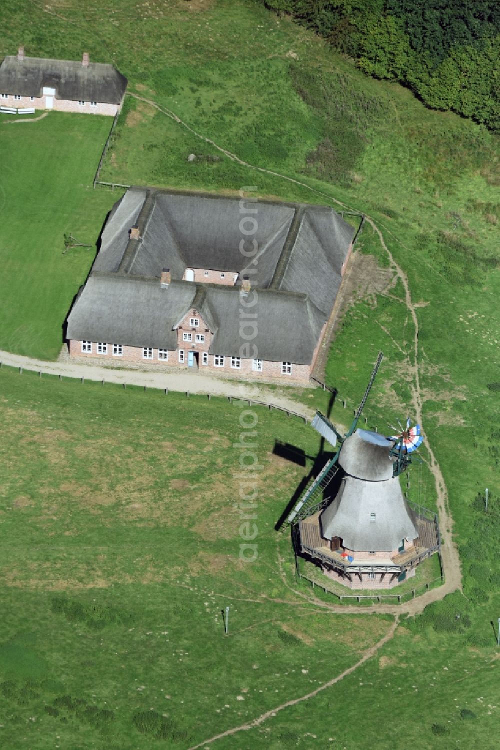 Rammsee from above - Historic windmill on a farm homestead on the edge of cultivated fields in Rammsee in the state Schleswig-Holstein