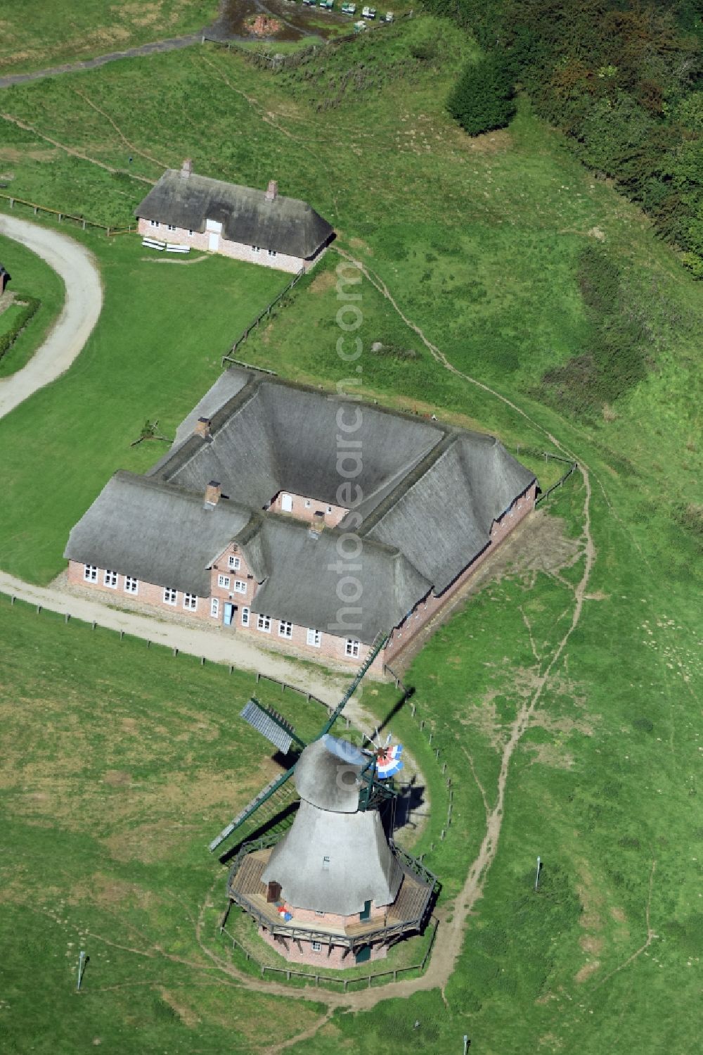 Rammsee from the bird's eye view: Historic windmill on a farm homestead on the edge of cultivated fields in Rammsee in the state Schleswig-Holstein