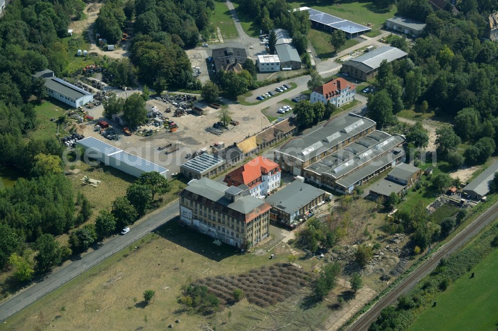 Leipzig from the bird's eye view: Historic residential and factory buildings in the Moelkau part of Leipzig in the state of Saxony. The buildings are located amidst fields and trees on Gutberlestrasse, the former industrial street. Today the area includes shops, stores and apartments