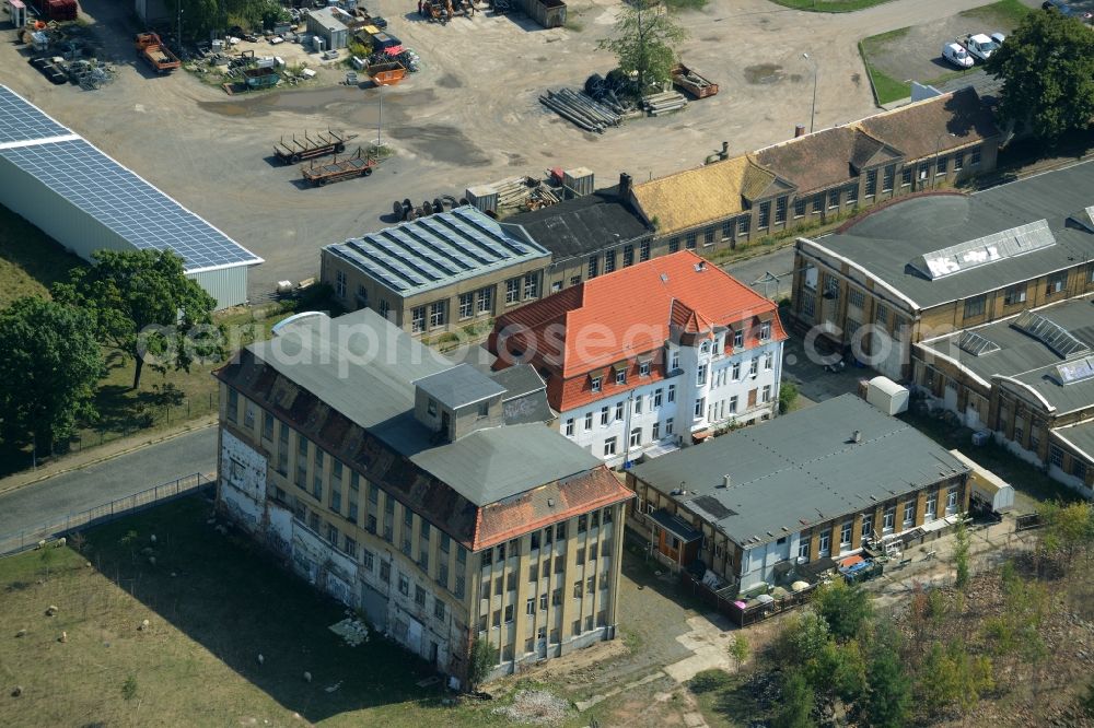 Aerial image Leipzig - Historic residential and factory buildings in the Moelkau part of Leipzig in the state of Saxony. The buildings are located amidst fields and trees on Gutberlestrasse, the former industrial street. Today the area includes shops, stores and apartments