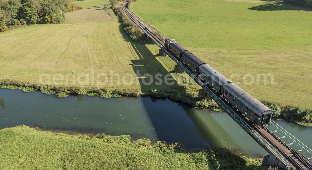 Wiesenttal from the bird's eye view: Historical train crossing the river Wiesent in Franconia in the district Streitberg in Wiesenttal in the state Bavaria