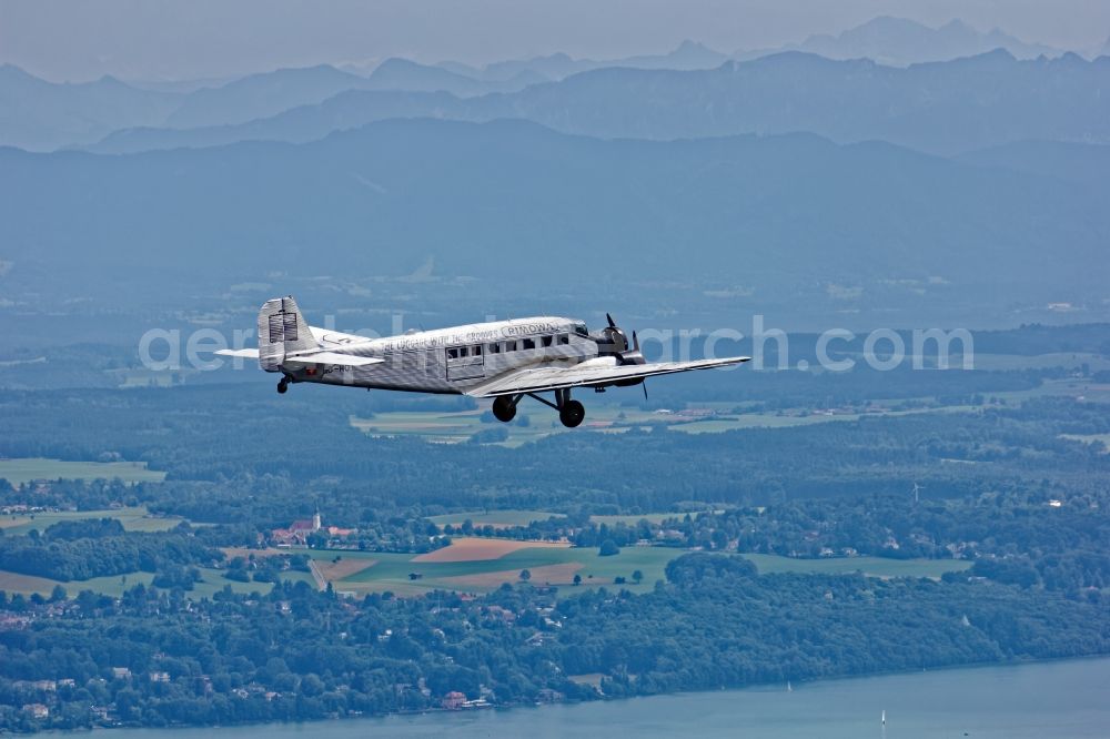 Aerial photograph Starnberg - Historic aircraft Junkers Ju 52 on the fly over the airspace near Starnberg in the state Bavaria, Germany