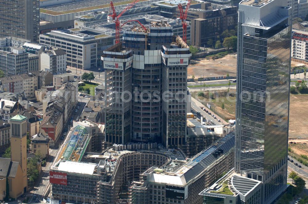 Aerial photograph Frankfurt am Main - Blick auf die Baustelle des Tower 185 , dem derzeit höchstem, in Deutschland im Bau befindlichen Wolkenkratzer. Bauherr ist die Vivico Real Estate. Die Wirtschaftsprüfungsgesellschaft PricewaterhouseCoopers (PwC) hat bereits vor Baubeginn 60.000 Quadratmeter von insgesamt rund 90.000 Quadratmeter Bürofläche langfristig angemietet und wird hier ihre neue Deutschland-Zentrale beziehen. Den Entwurf für den Tower 185 lieferte der Frankfurter Architekt Christoph Mäckler. Er sieht ein hufeisenförmig angelegtes Sockelgebäude vor, aus dem sich die beiden Hochhaushälften mit einer Aluminium-Glas-Fassade erheben. View of the construction site of Tower 185, currently the highest in Germany under construction skyscraper. Owner is the Vivico real estate.