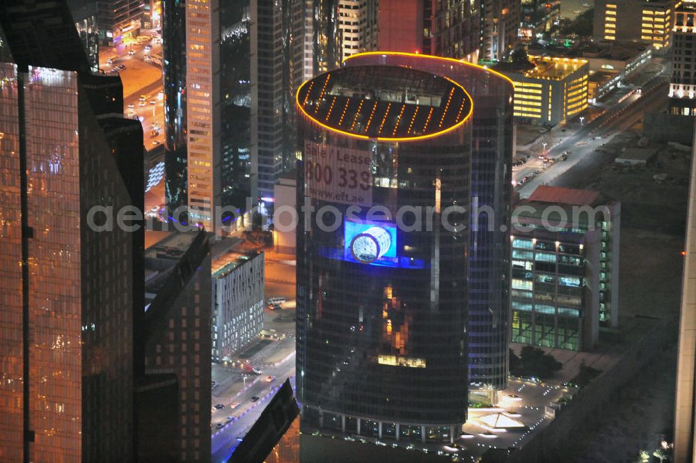 Aerial photograph DUBAI / DUBAYY - Nachtluftbild vom Hochhaus Emirates Financial Tower im Dubai International Financial Centre. Das Büro- und Geschäftshochhaus wurde durch das türkische Unternehmen TAV Construktion gebaut. Emirates Financial Towers are commercial business towers located in the heart of the Dubai International Financial Centre, Dubai’s central financial district. Emirates Financial Towers is a joint venture between ENSHAA and Moafaq Al Gaddah Group.