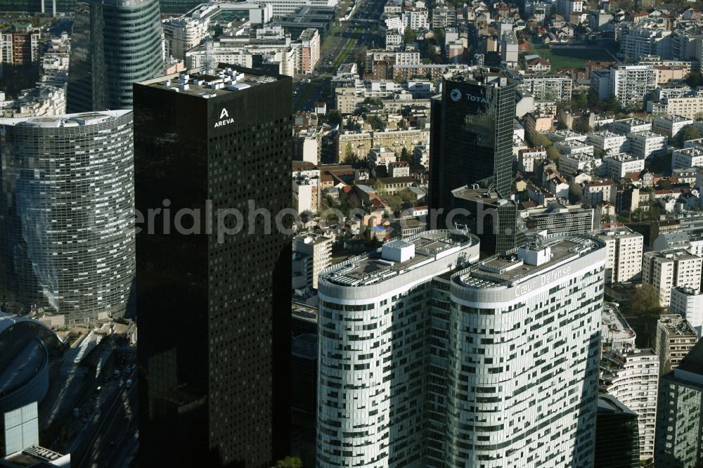 Paris from the bird's eye view: High-rise building Coeur Defense in the office and highrise quarter La Defense in Paris in Ile-de-France, France. The black skyscraper of the oil company Total Tour Total Coupole is located in the background. Tour Areva with the French nuclear company is located next to it