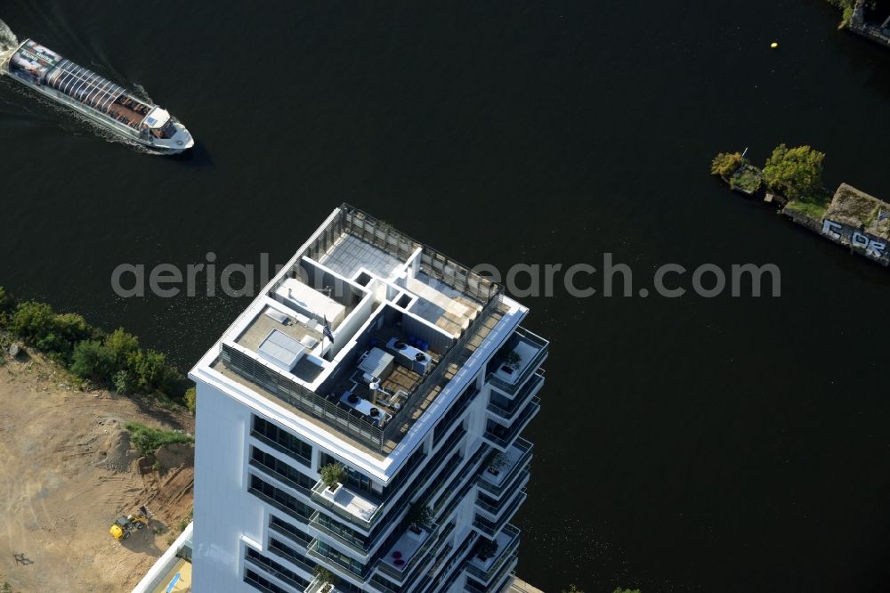 Berlin from above - Project Living Levels at Muhlenstrasse on the banks of the River Spree in Berlin - Friedrichshain. On the grounds of the Berlin Wall border strip at the EastSideGallery, the company Living Bauhaus is building a futuristic high-rise residential. The real estate service company City & Home GmbH manages the available apartments